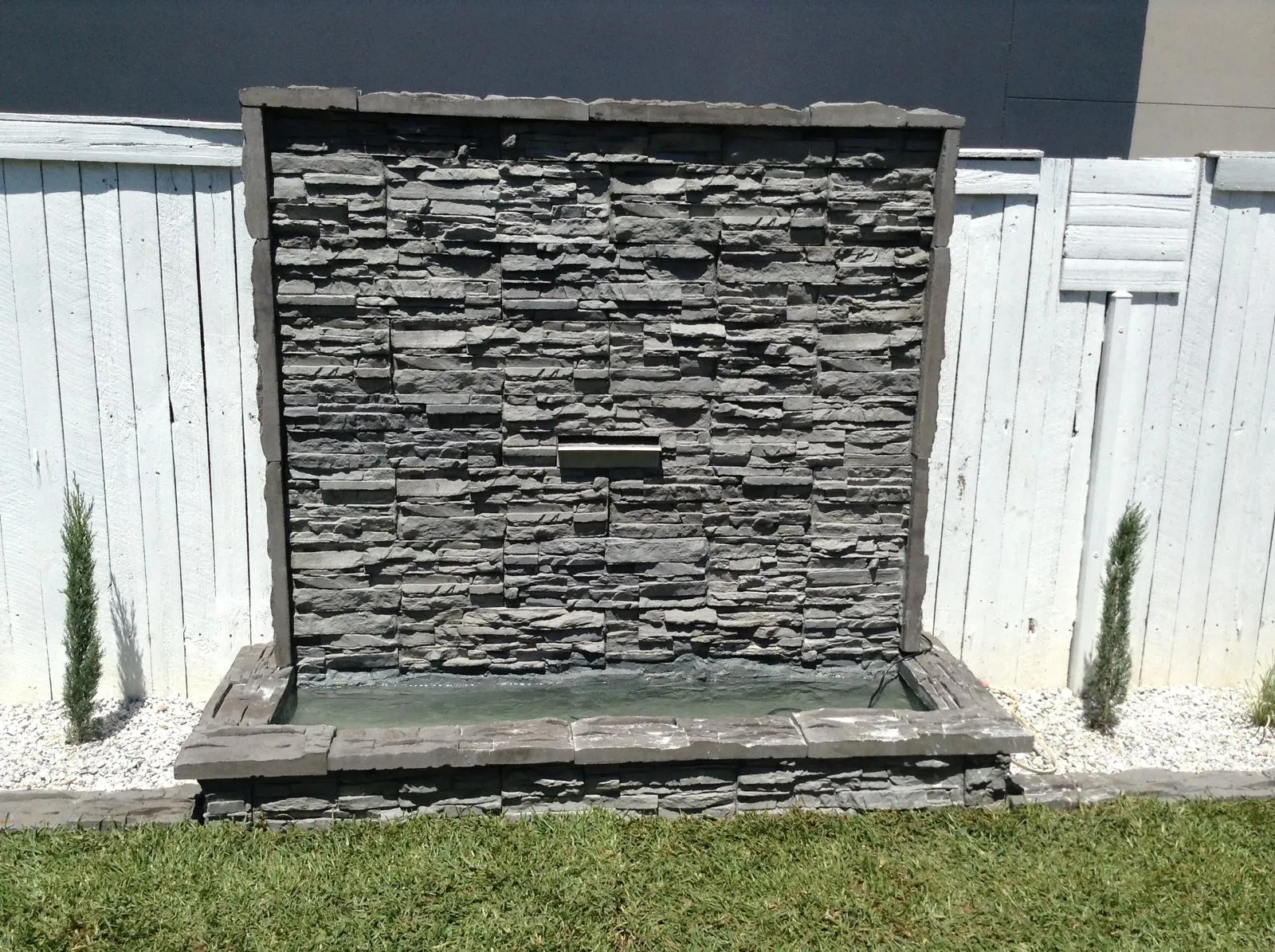 Steve-made stacked stone water feature in a Central Coast backyard