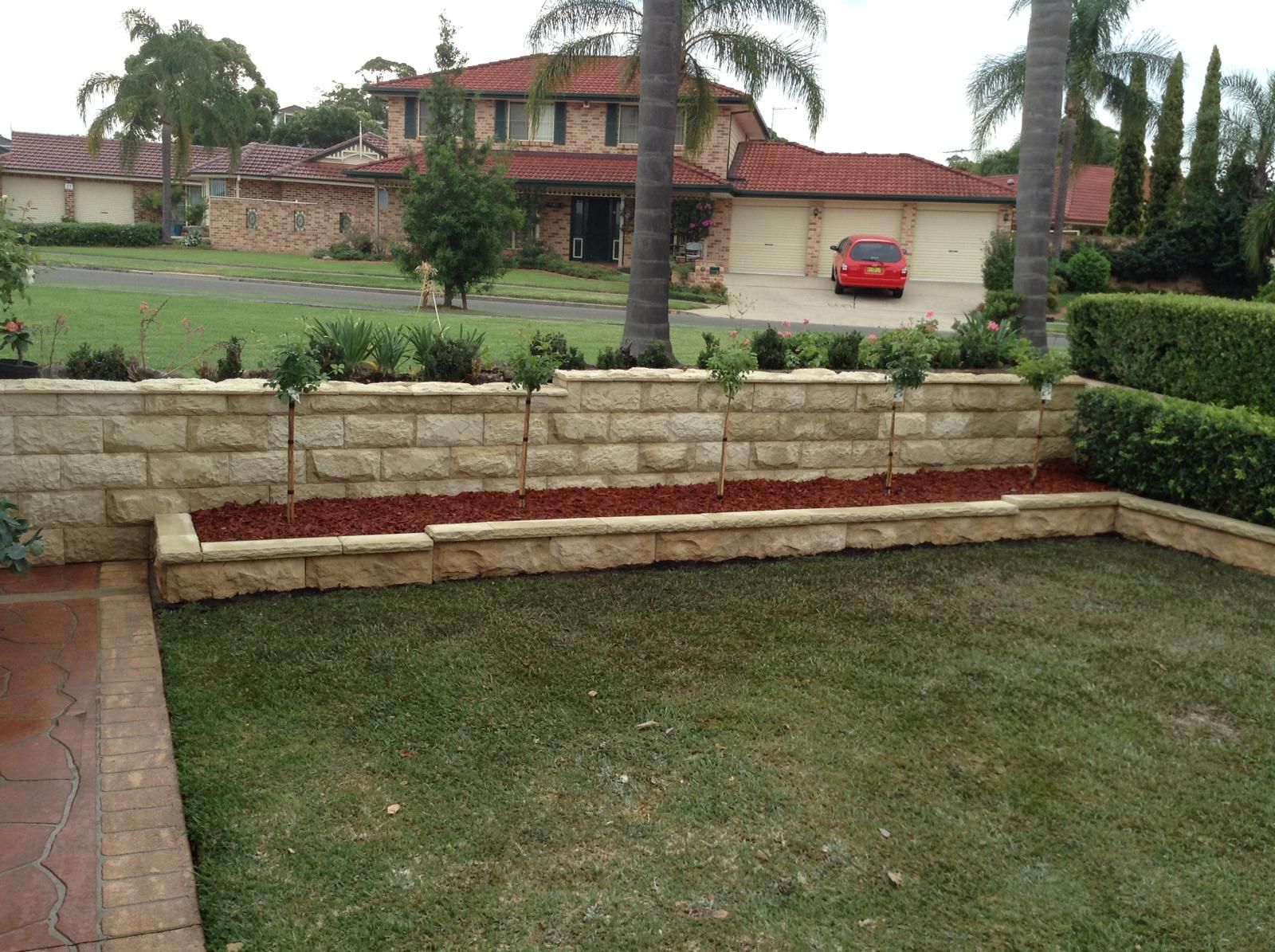 Retaining wall and steps on a sloped Central Coast block