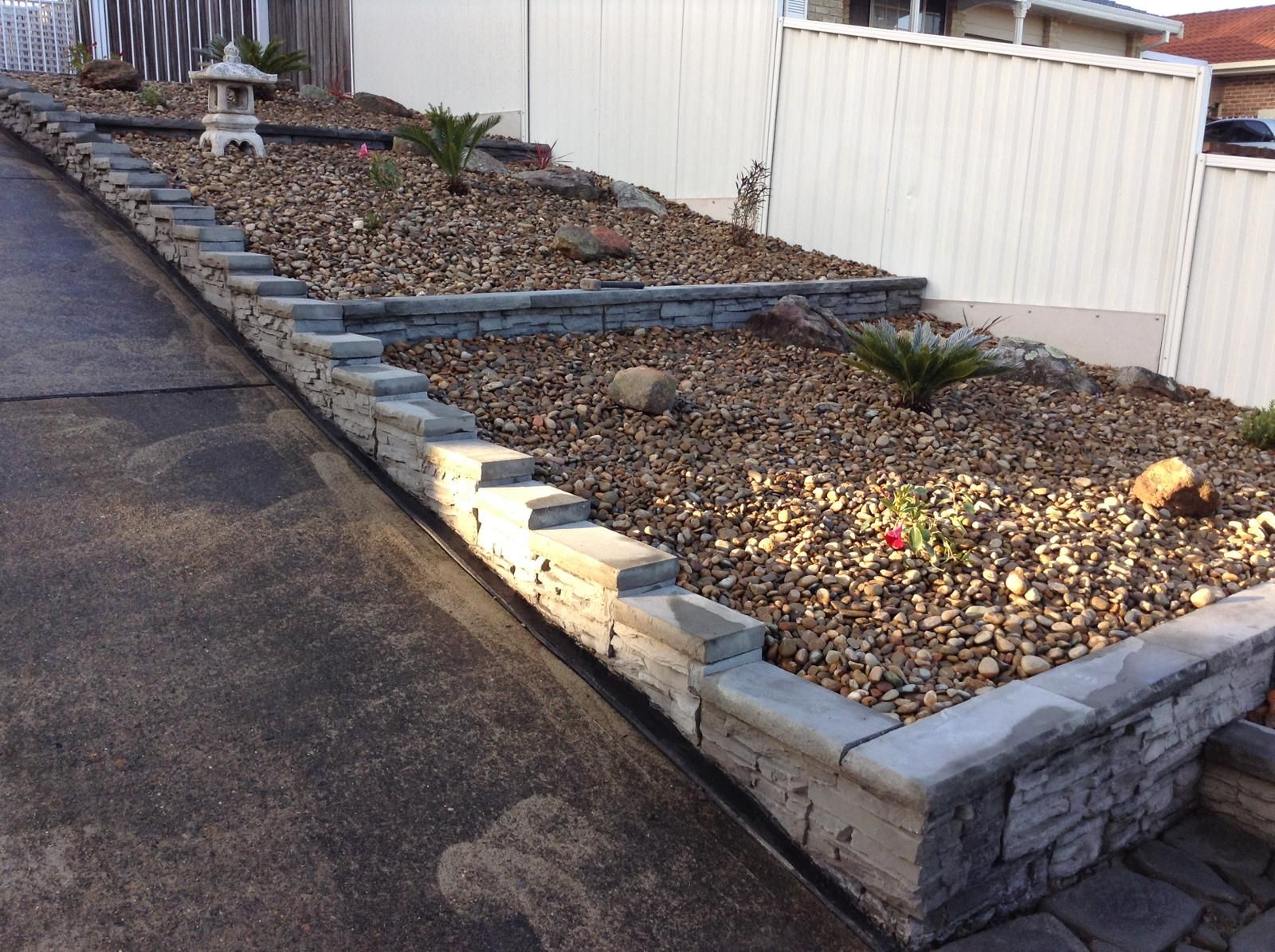 Curved retaining wall built with Steve-made blocks