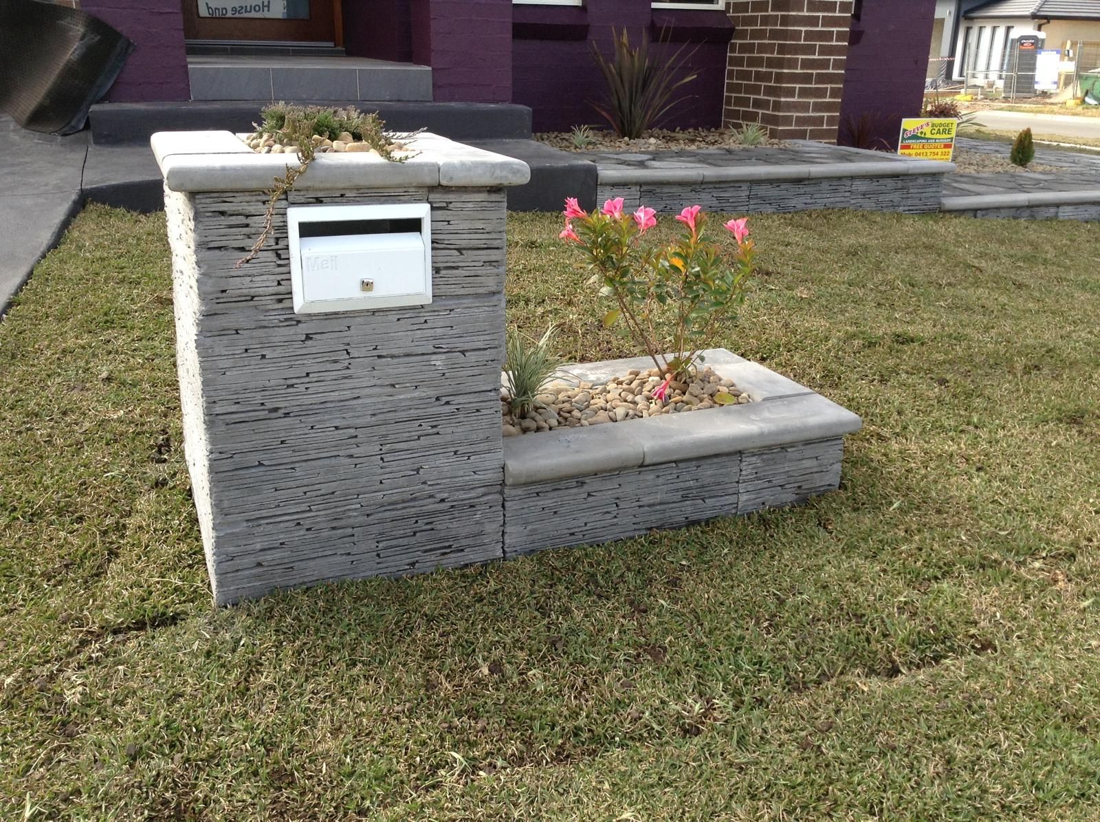 Poolside retaining wall and paving