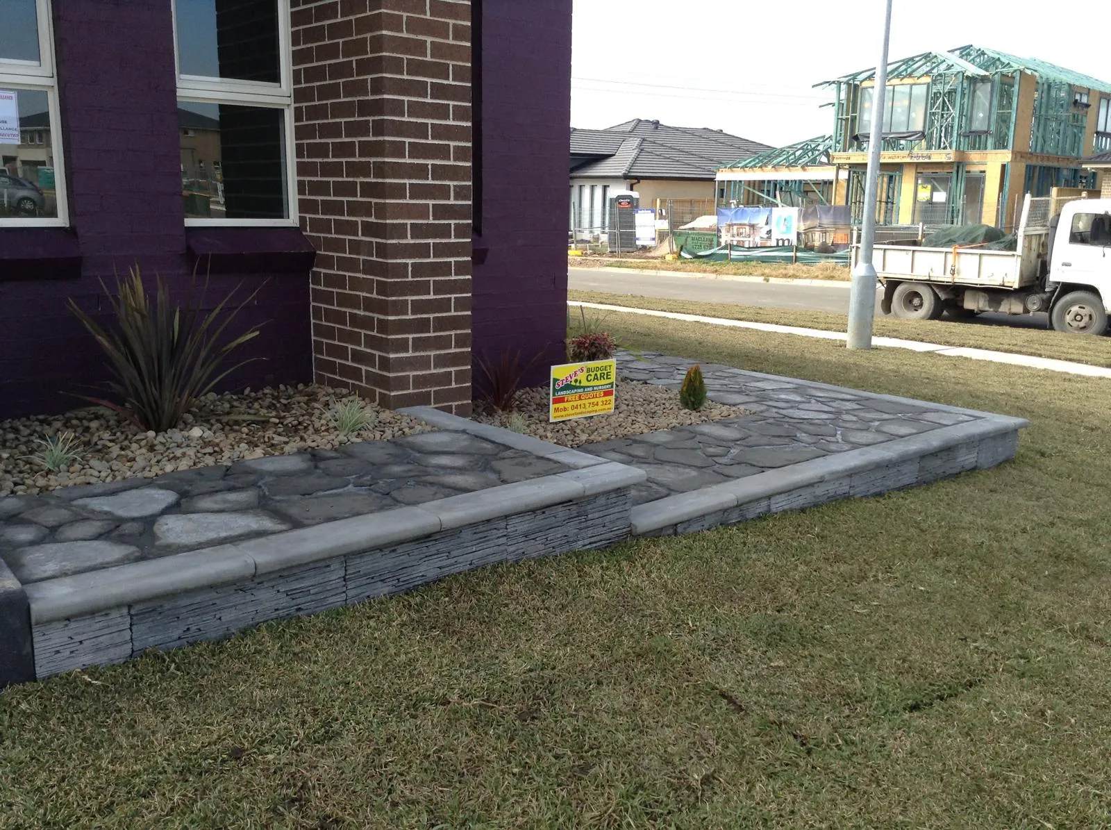 Crazy-pave pathway and edging in a coastal front yard