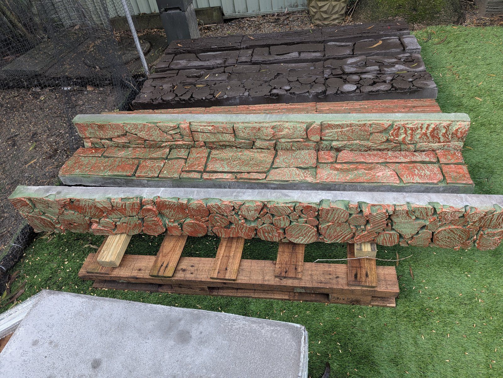 Steve hand-finishing a custom concrete piece in his Wyong workshop