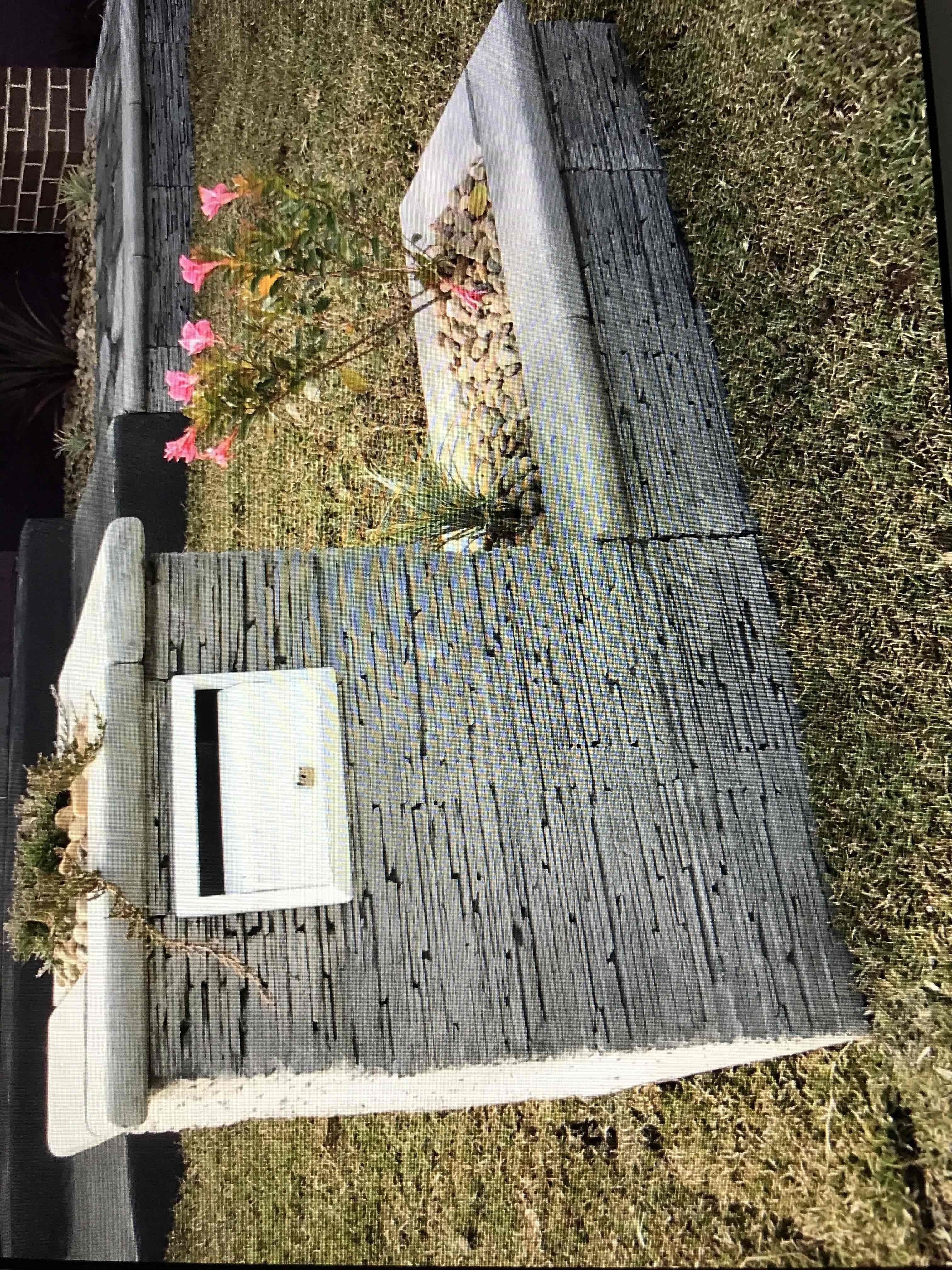 Stone-clad letterbox and retaining wall