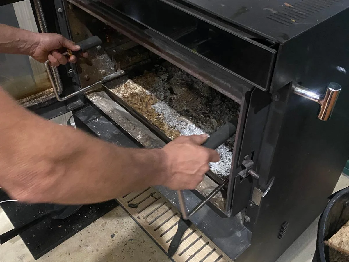 Fireplace tray sliding into a fireplace